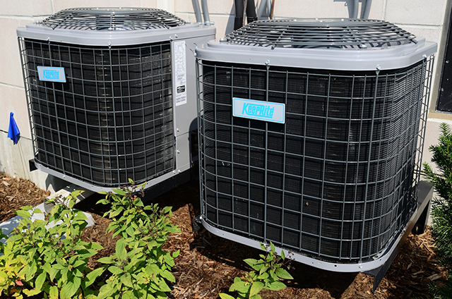 Two air conditioning units outside a house in Mesa