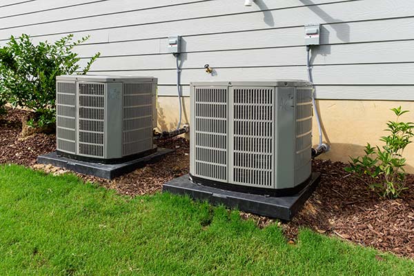 Two air conditioning units outside a residential home in Chandler