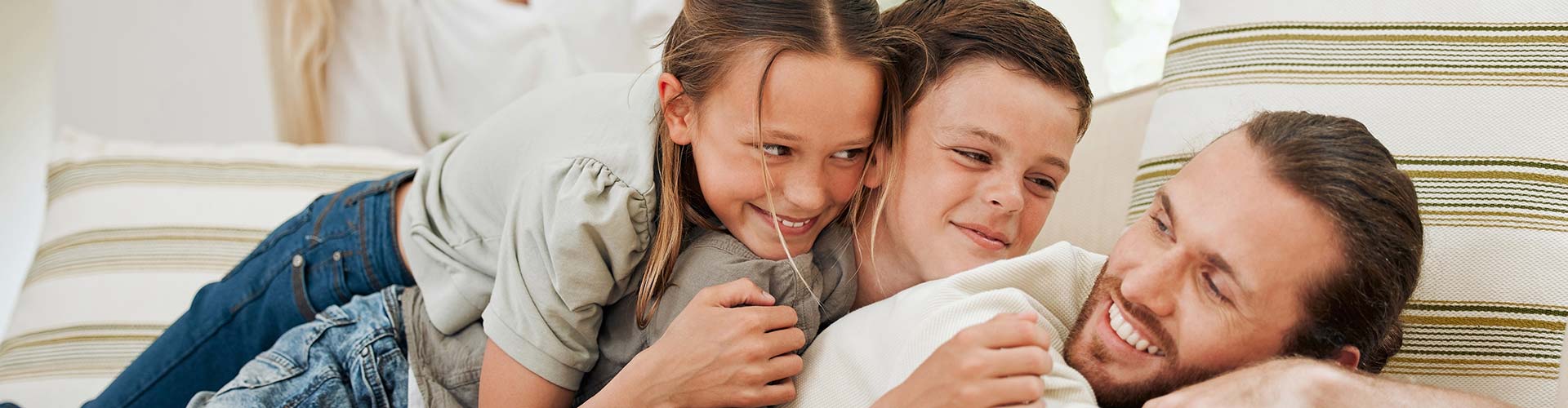 A parent and child hugging in a comfortable home